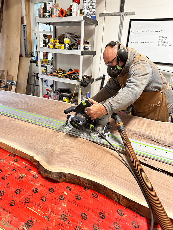 Ronald Lohse cutting a walnut slab