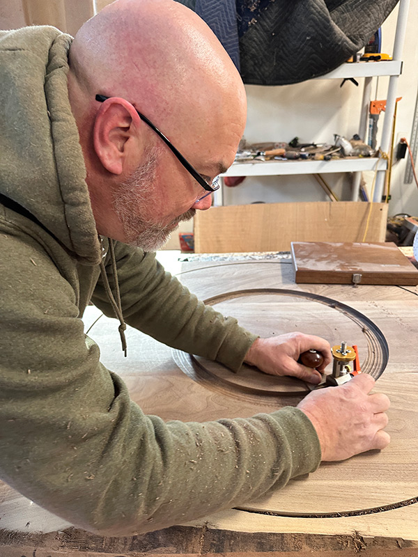 Ronald Lohse cutting a walnut slab